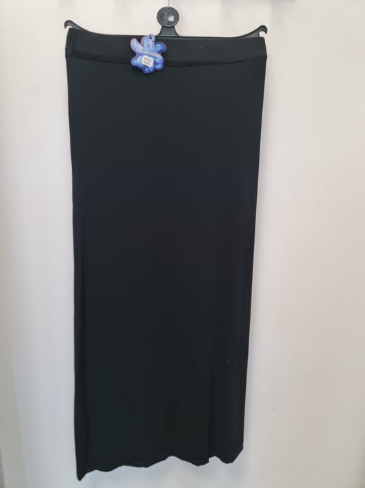 The Stylish Jersey Pencil Skirt (Slim Fit, Size L-M) from Bihi Boutique hangs on a black hanger against a white wall, accented with a purple butterfly-shaped clip near the waistband.